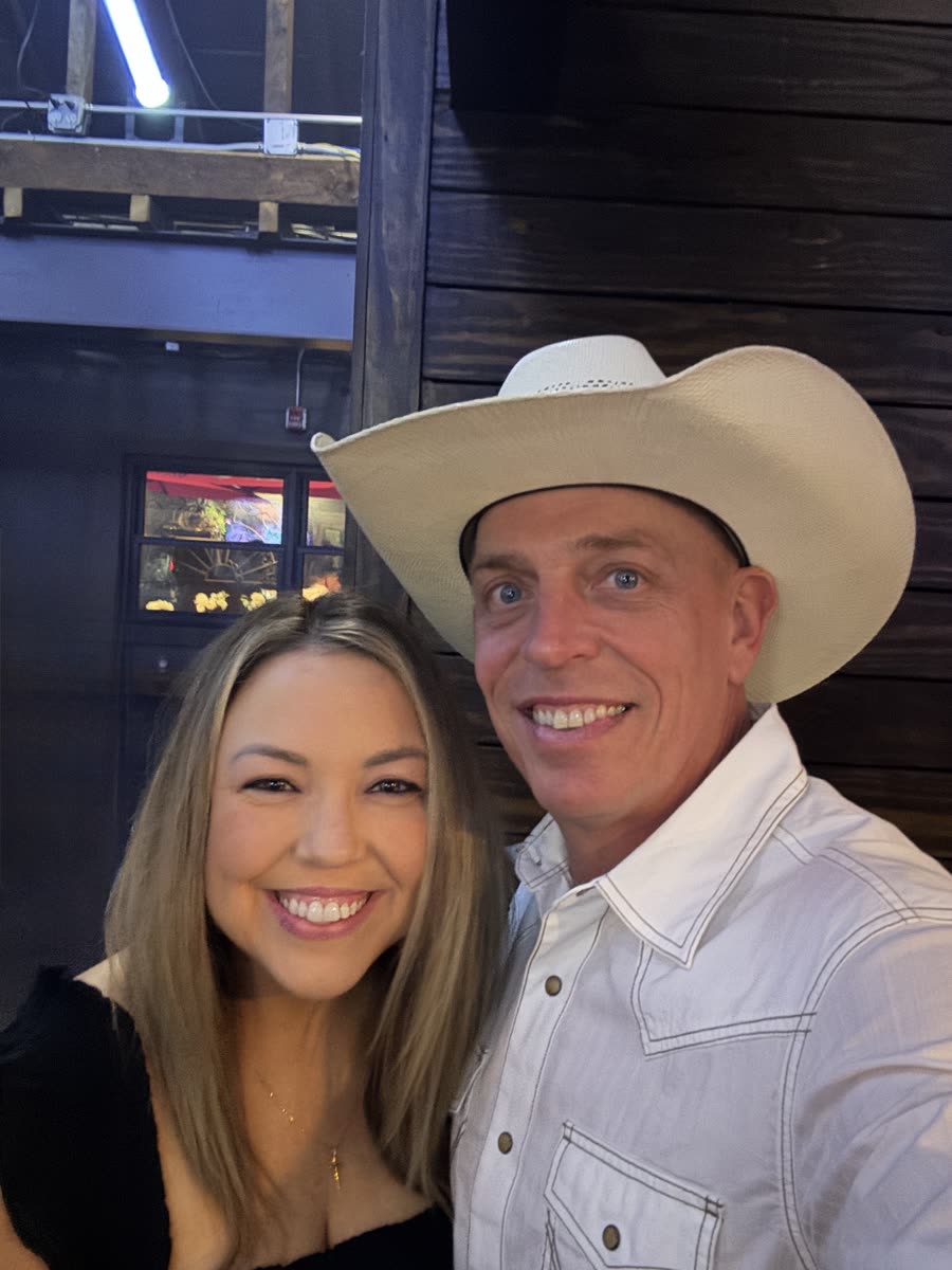 Ashley and Steve smiling, Steve in a white cowboy hat